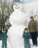 Fun Family Time Buiding a Giant Snowman